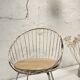 Basket armchair in metal and wood.