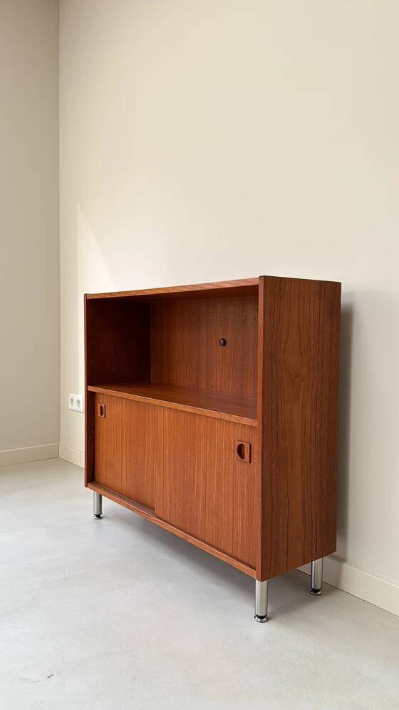 Vintage wooden cabinet with sliding doors