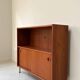 Vintage wooden cabinet with sliding doors