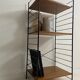 small vintage metal and teak string bookshelf