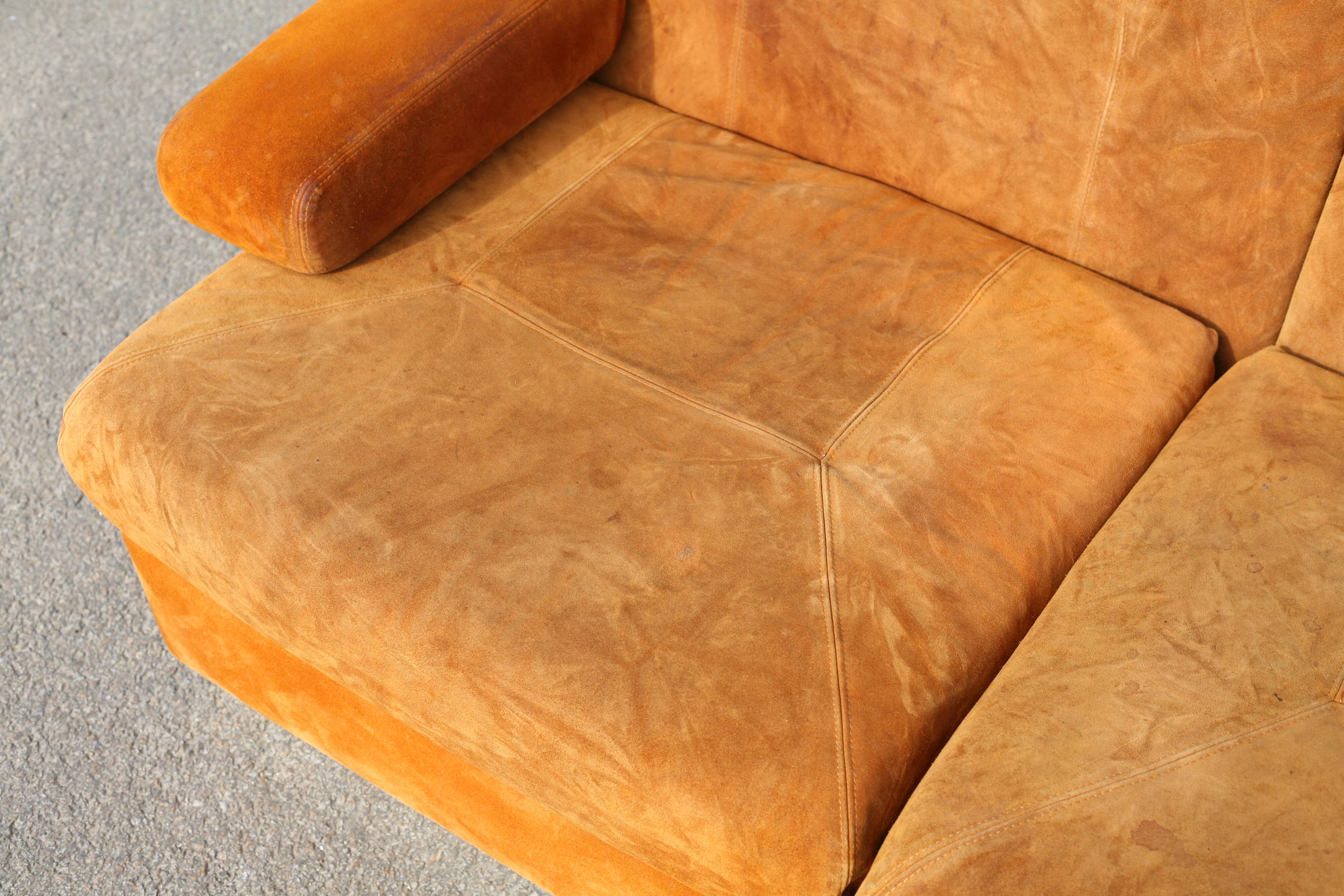 Orange suede leather and steel sofa. Circa 1970