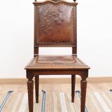 Set of 4 Louis XVI style chairs in carved wood and embossed leather.