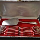 12 cake forks and a silver metal server.