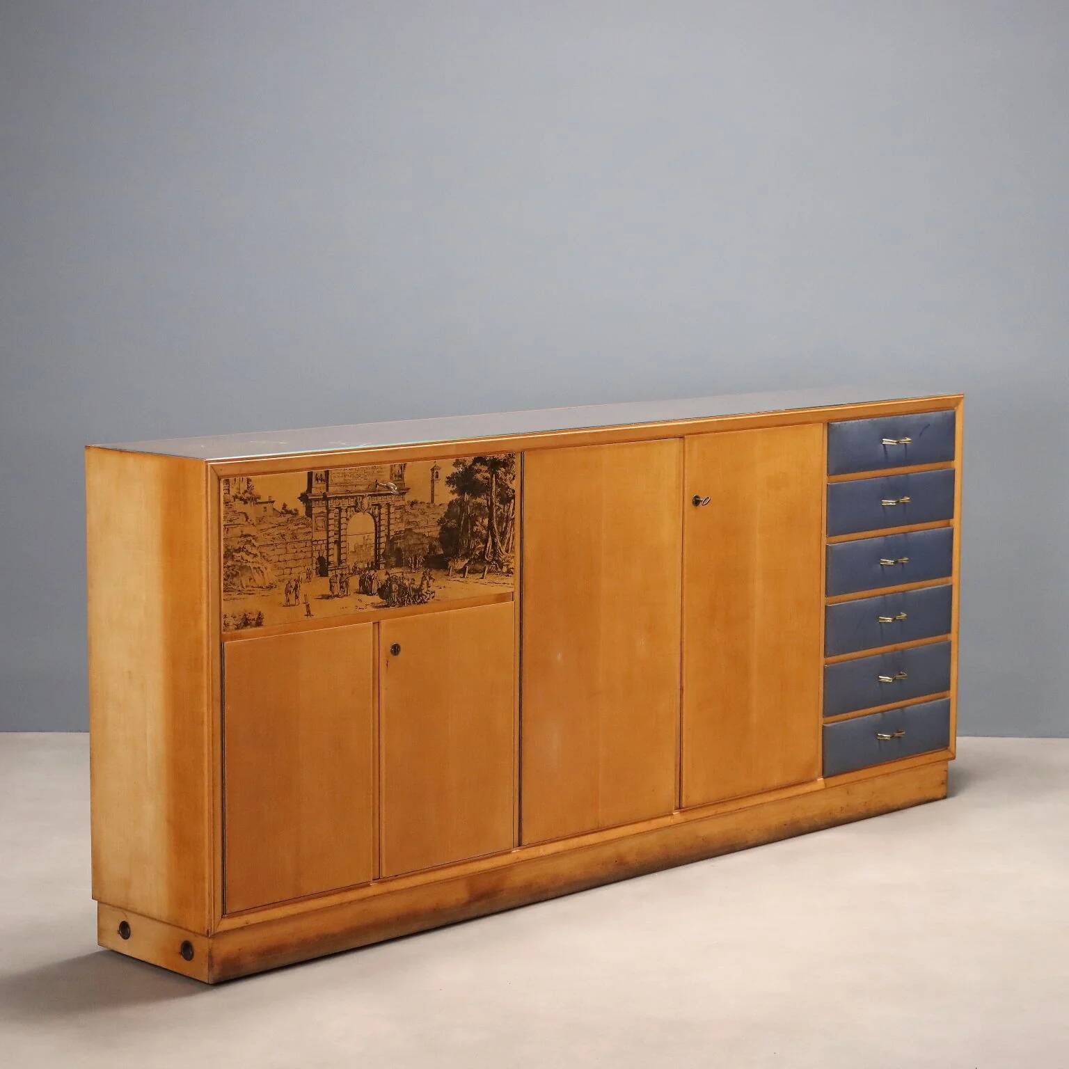 Vintage storage furniture in maple veneer with a glass top, Italian design 1950s.