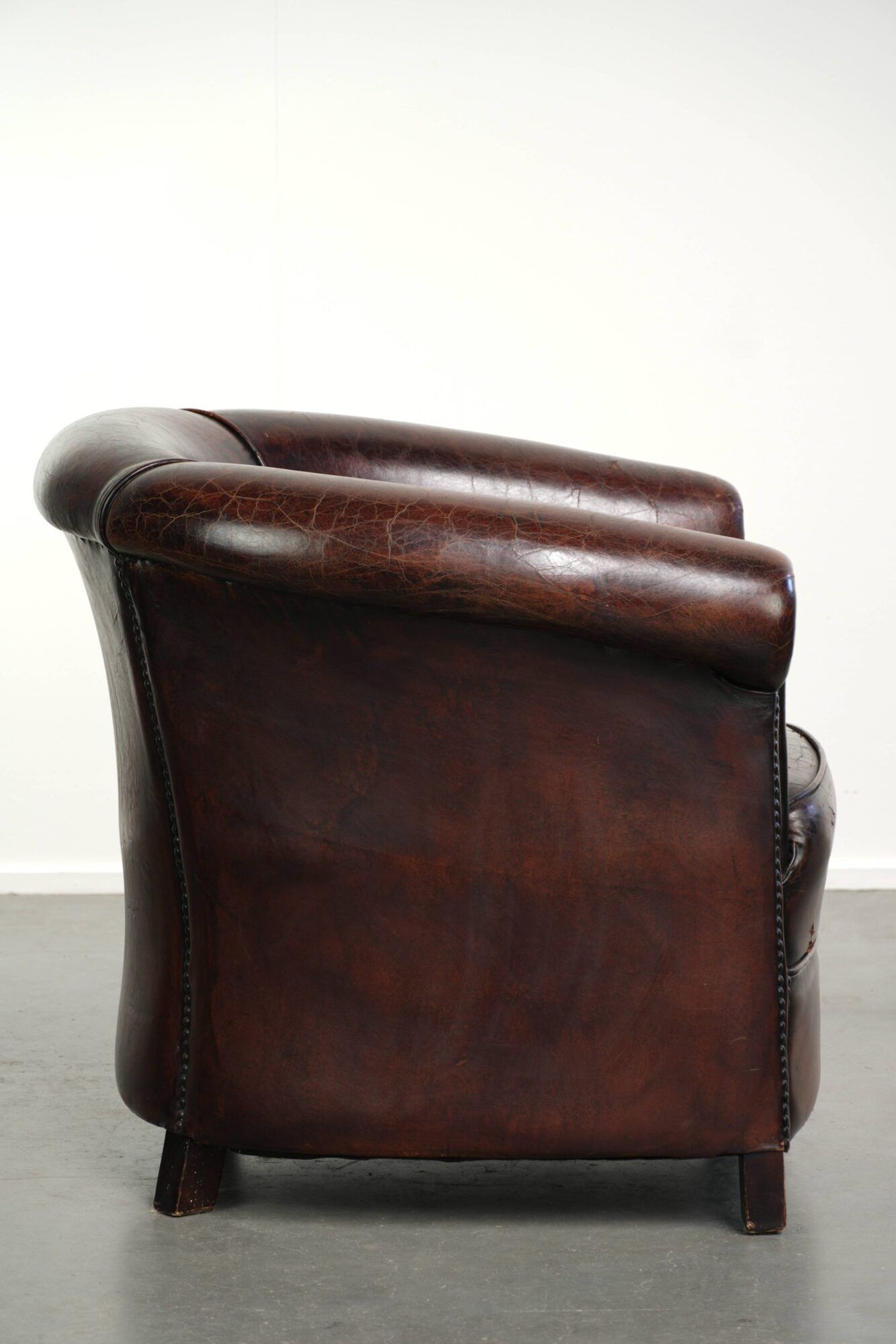 Vintage sheepskin club armchair with beautiful colours and a subtle size