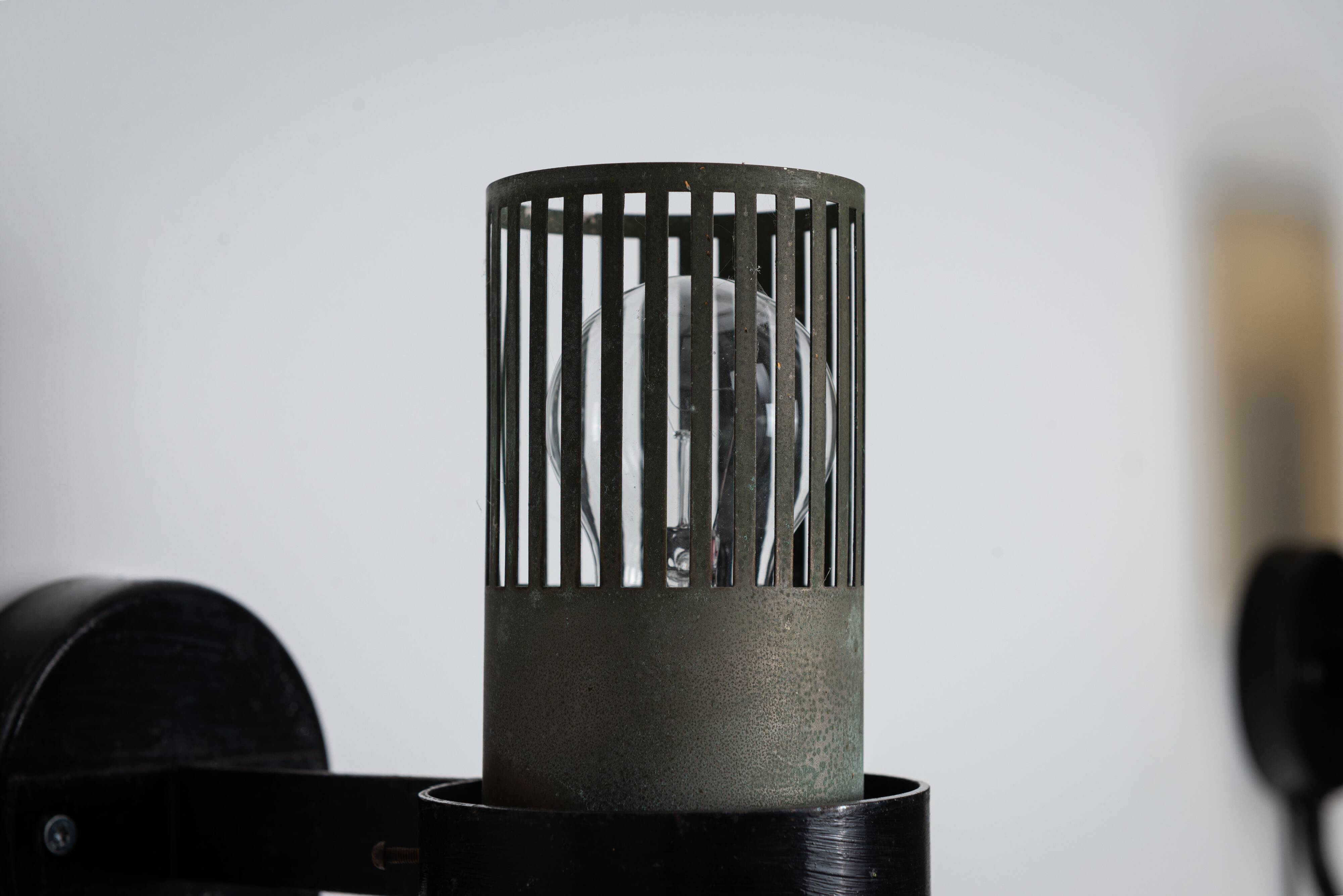 Pair of black metal wall lamps with yellow shades and inner diffuser