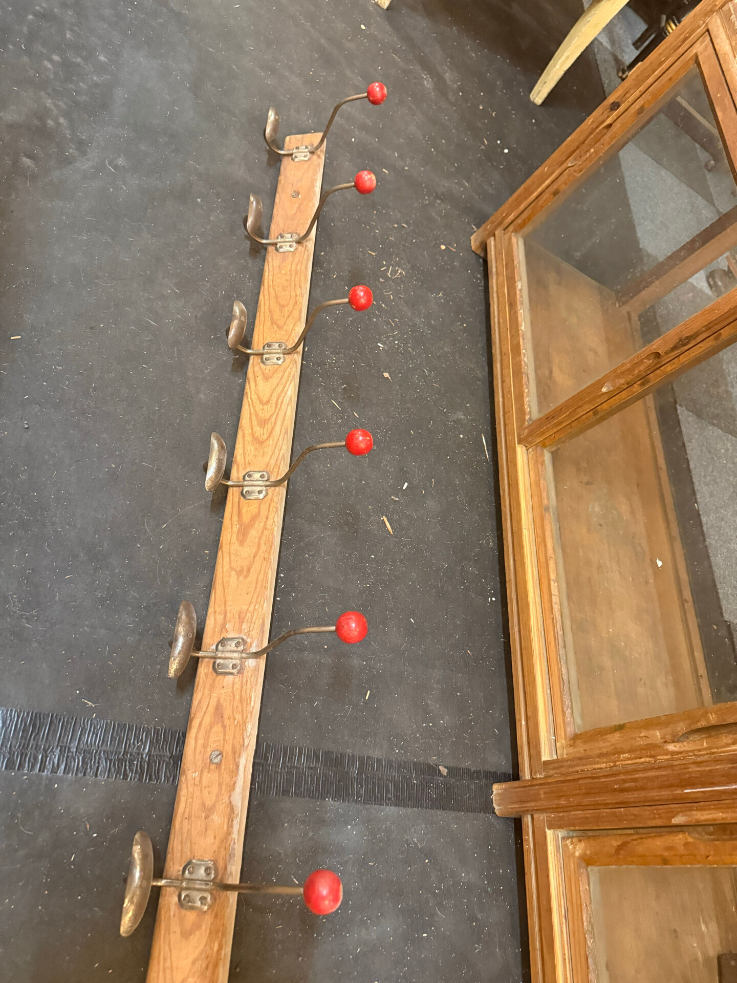 school coat rack / changing room with 10 red ball hooks