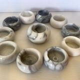 Eleven marble candlesticks