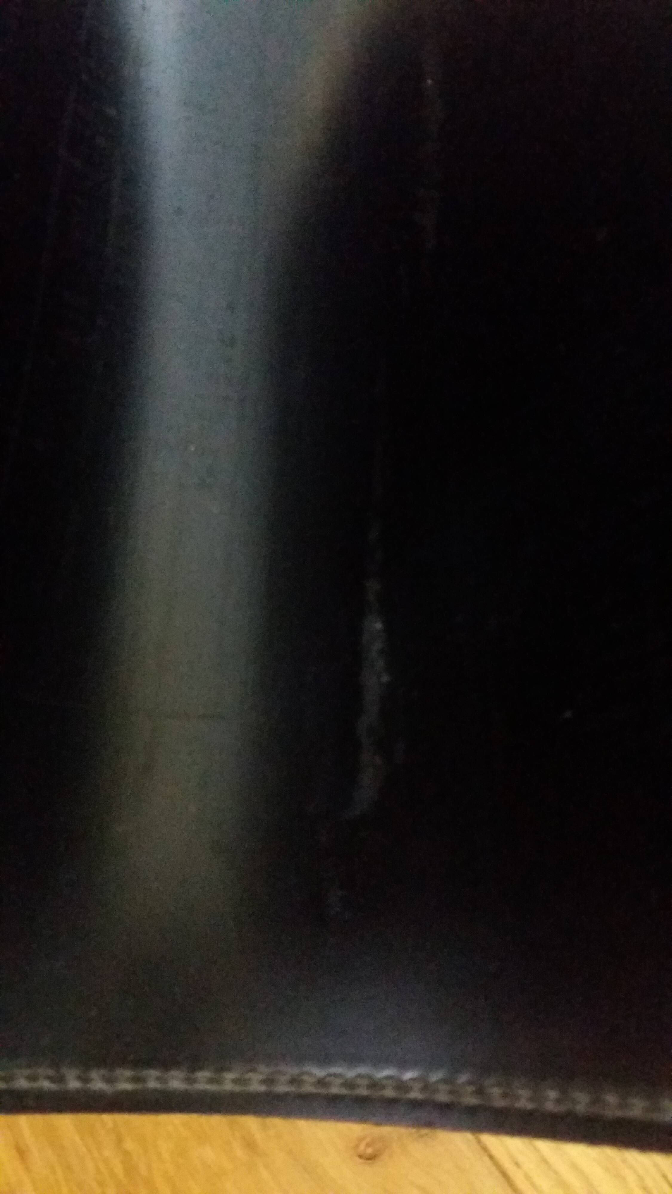 Modernist magazine rack in the style of Jacques Adnet