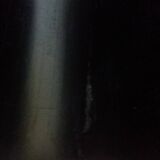 Modernist magazine rack in the style of Jacques Adnet