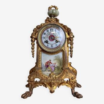 Napoleon III clock in gilded bronze and porcelain plates decorated and painted by hand