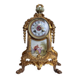 Napoleon III clock in gilded bronze and porcelain plates decorated and painted by hand