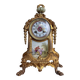 Napoleon III clock in gilded bronze and porcelain plates decorated and painted by hand