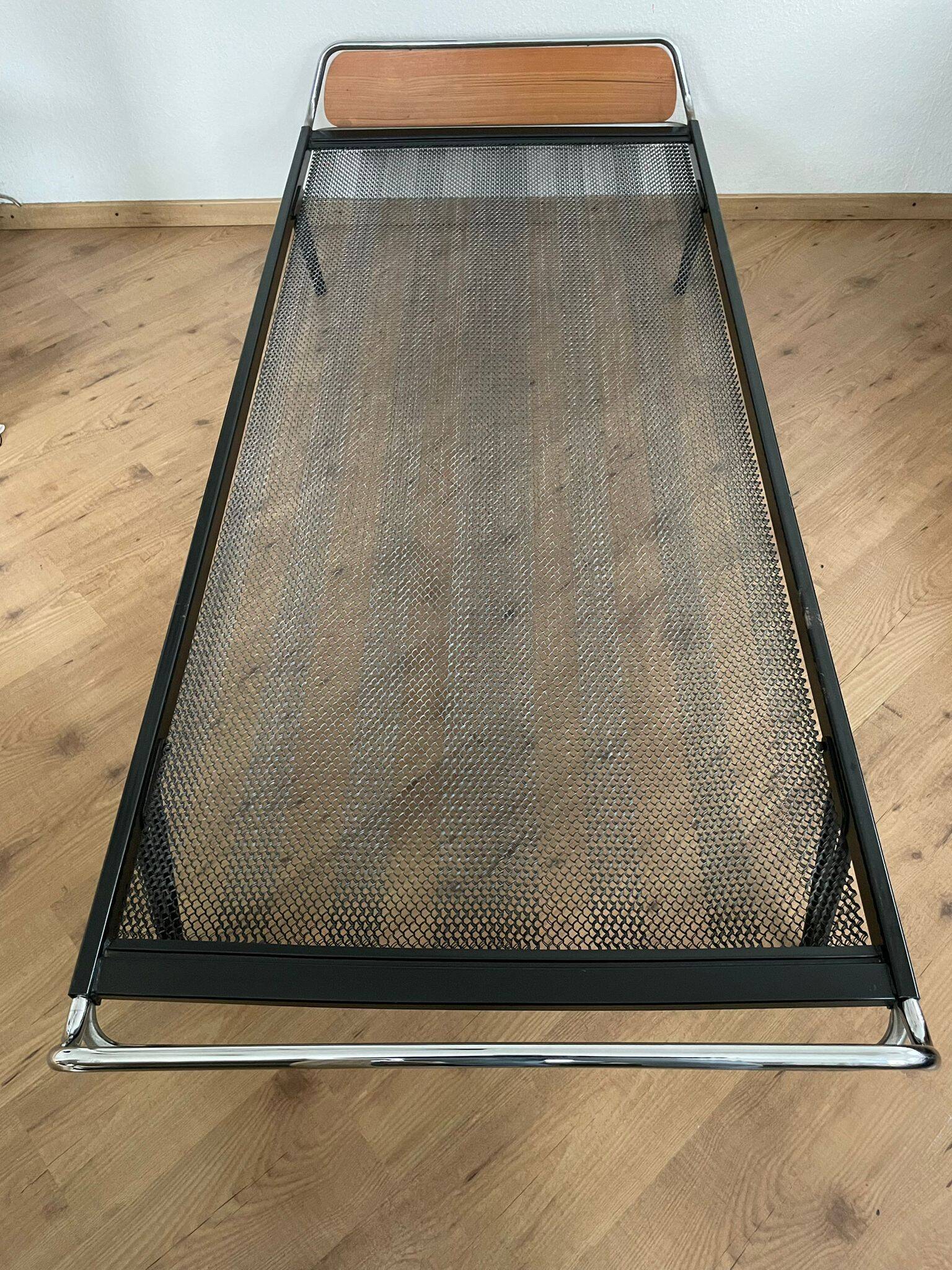 Pair of teak and chrome beds with mattress