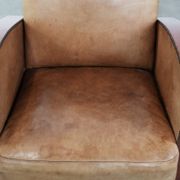Art Deco design armchair in light cognac cowhide leather.