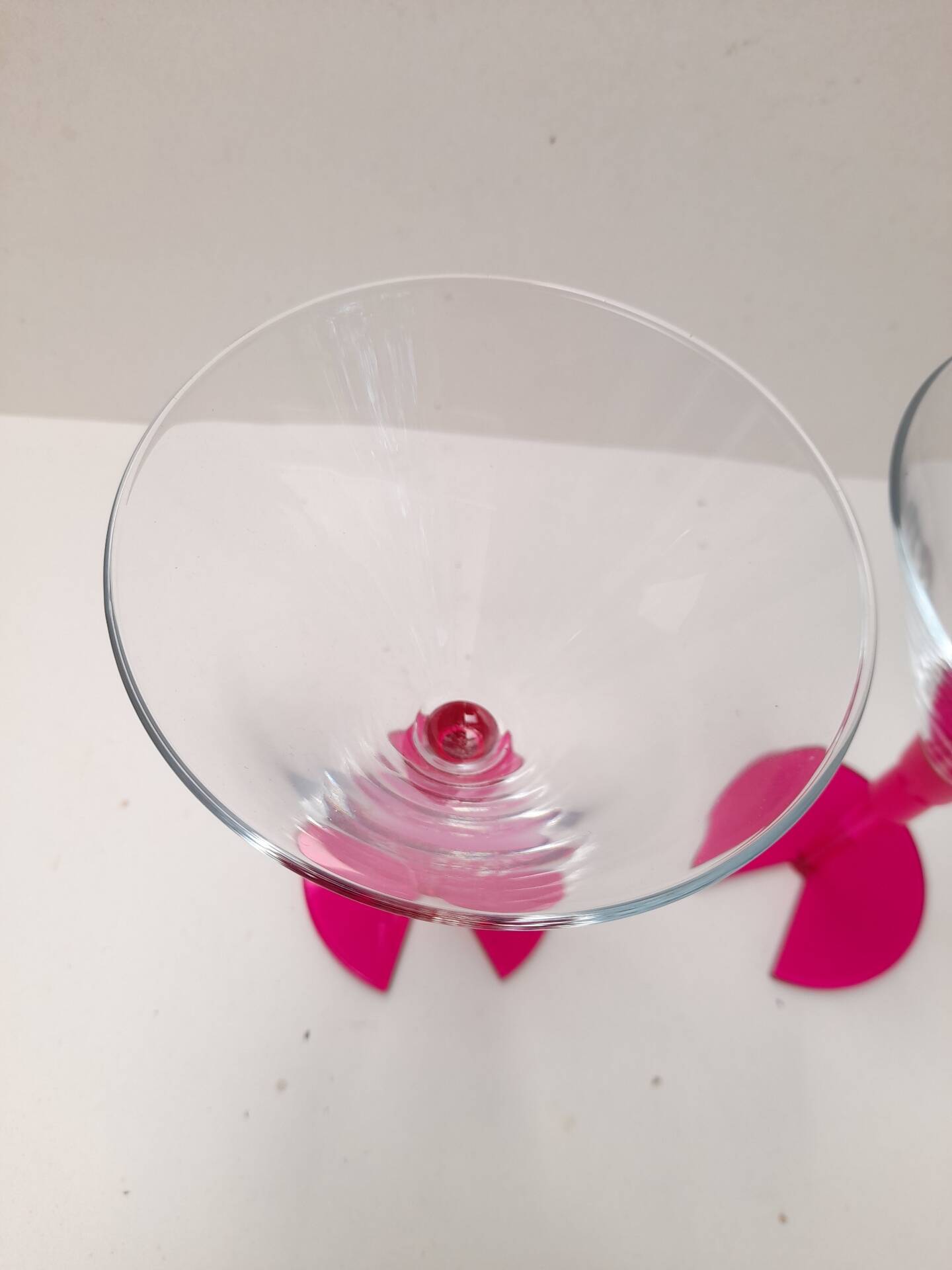 Pair of bright pink cocktail glasses from the 80s.