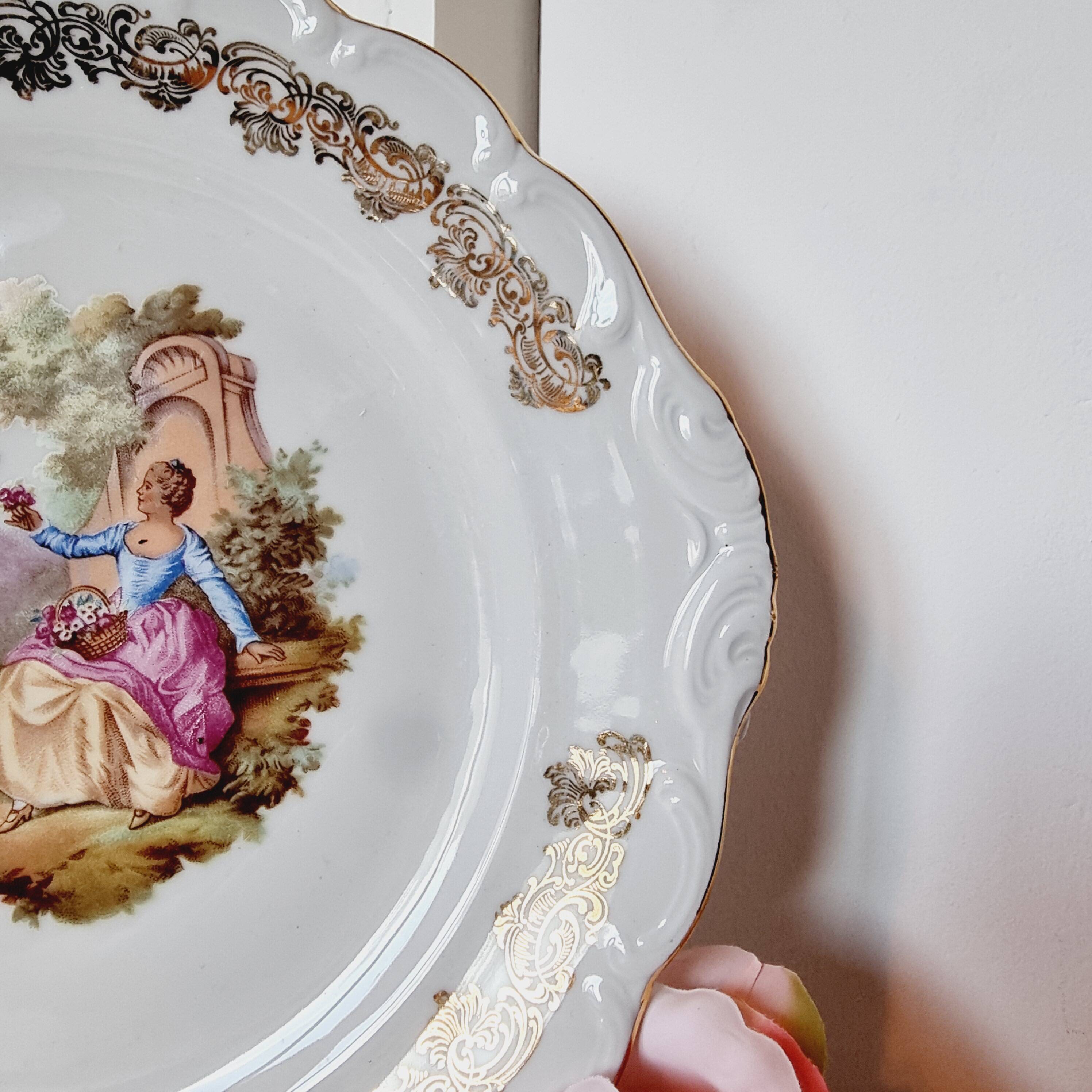 Large serving plate with romantic Frangonard scene with 24 carat gold