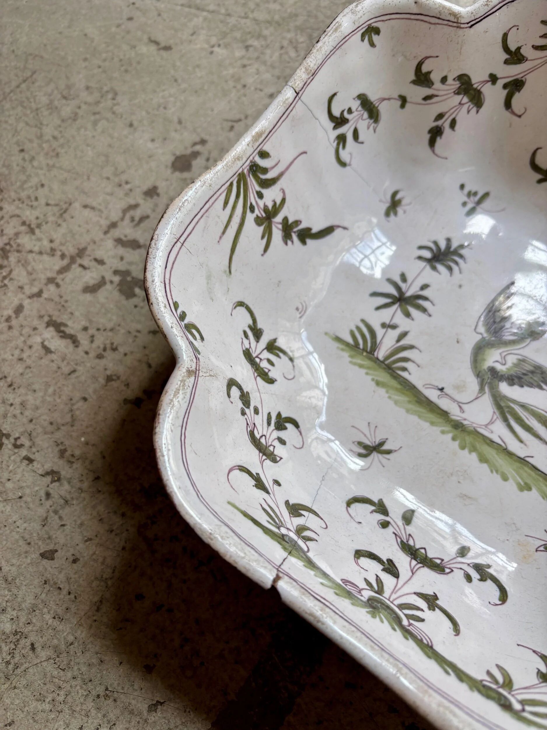 Moustiers salad bowl in cream and green earthenware, 18th century.