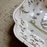 Moustiers salad bowl in cream and green earthenware, 18th century.