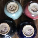 A set of 4 pottery bowls in coloured glaze.