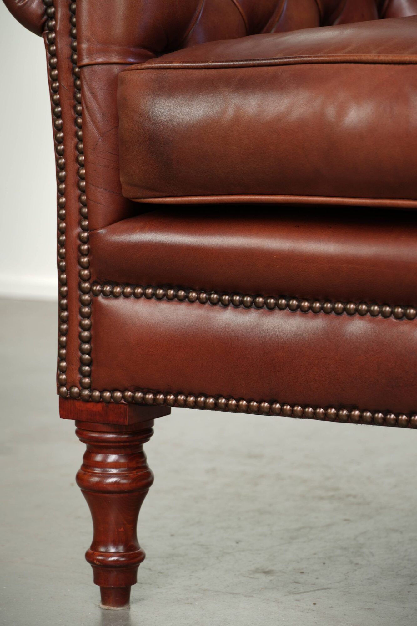 Cognac-coloured cow leather Chesterfield armchair in English style