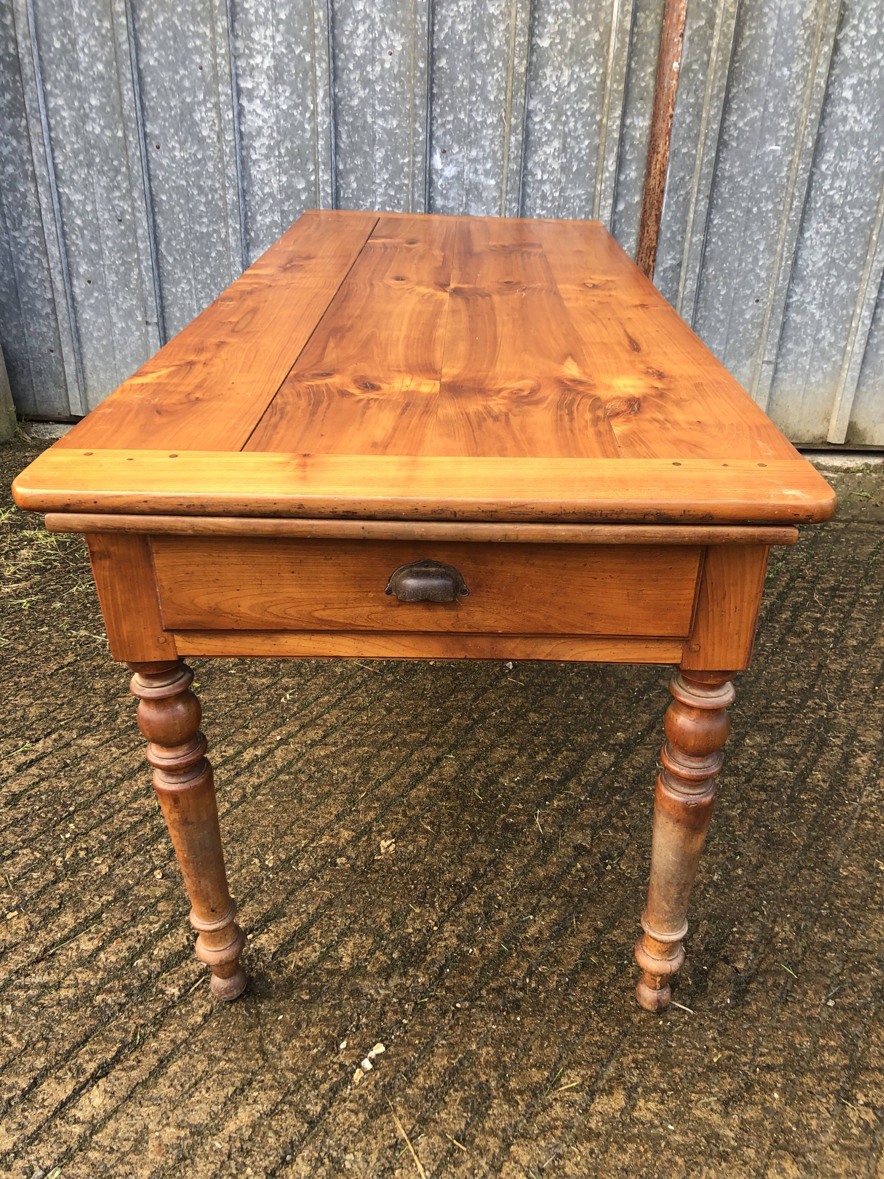 Antique farmhouse table in solid cherry wood in Louis Philippe style.