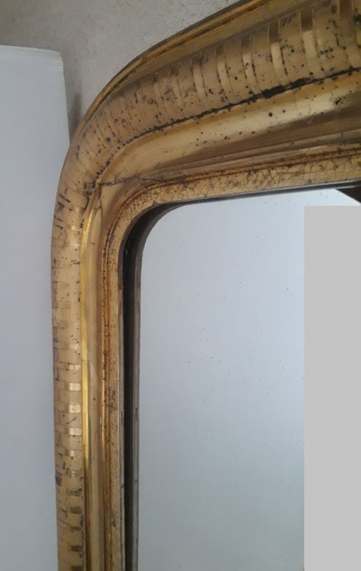 Golden Louis Philippe mirror H122xW84cm with gilded motifs.