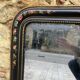 Antique Napoleon III mirror, black frame with hand-painted floral decoration – 19th century