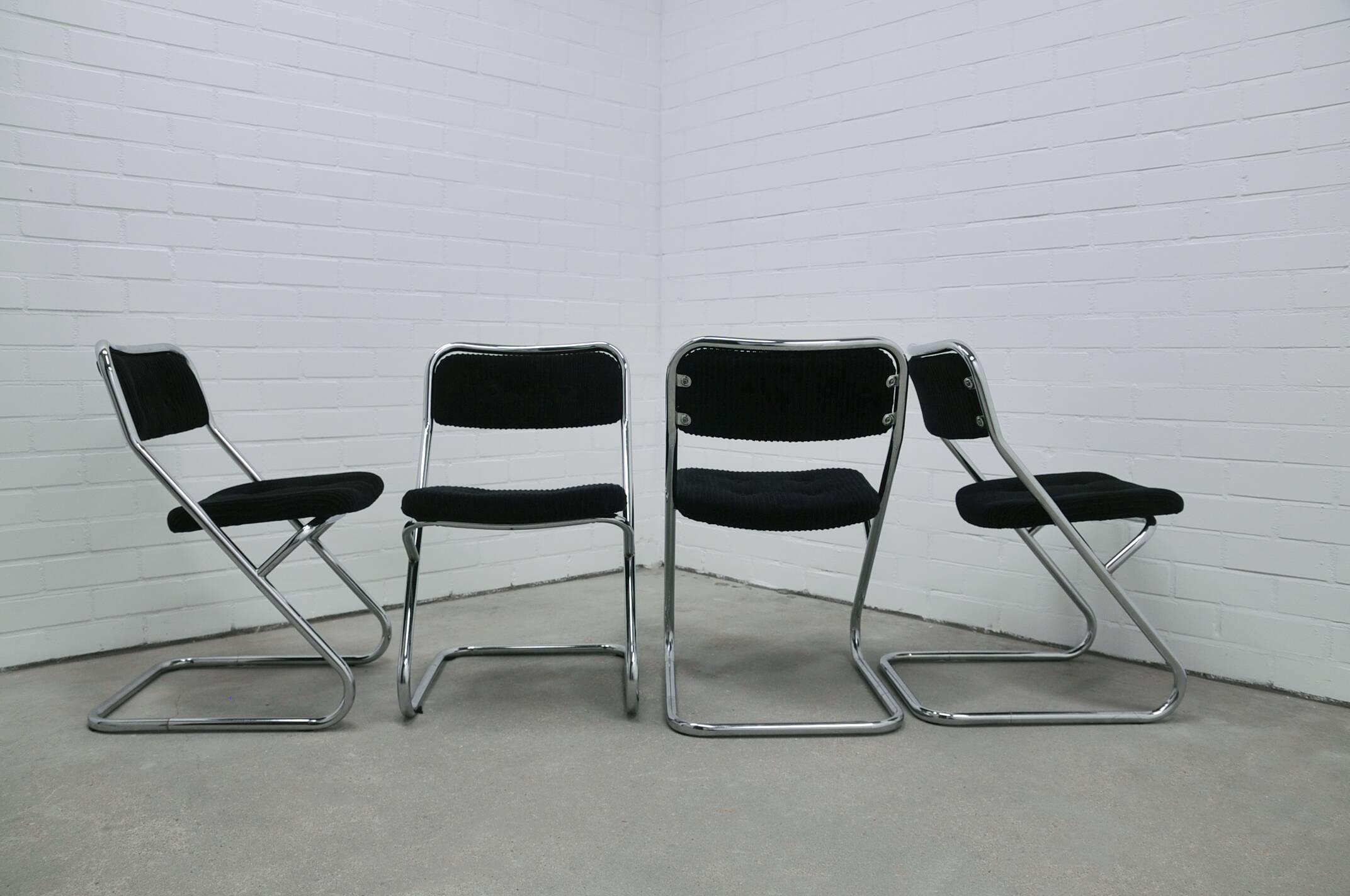 vintage set of x4 chrome tubular chairs black rib