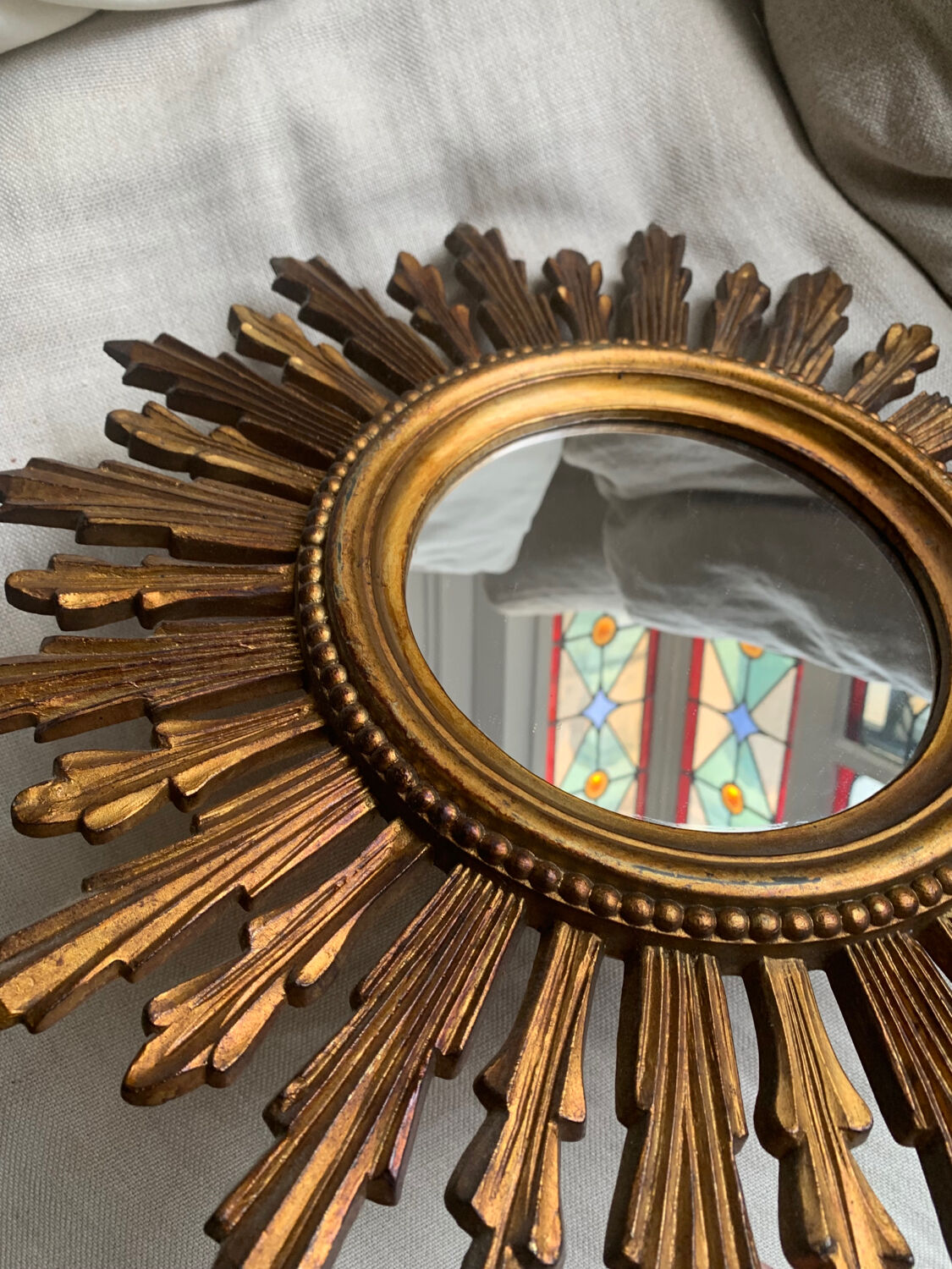 Sun mirror in old wood
