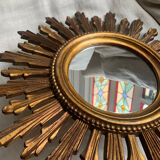 Sun mirror in old wood