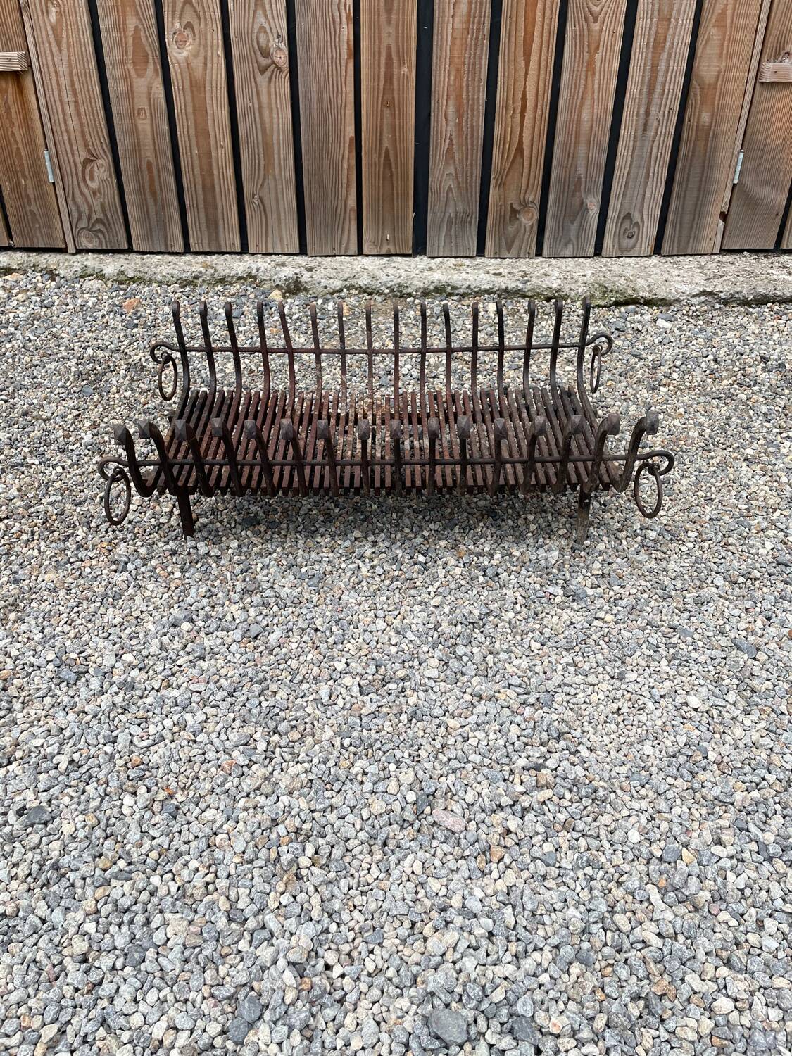 Vintage cast iron fireplace cradle with 16 bars.