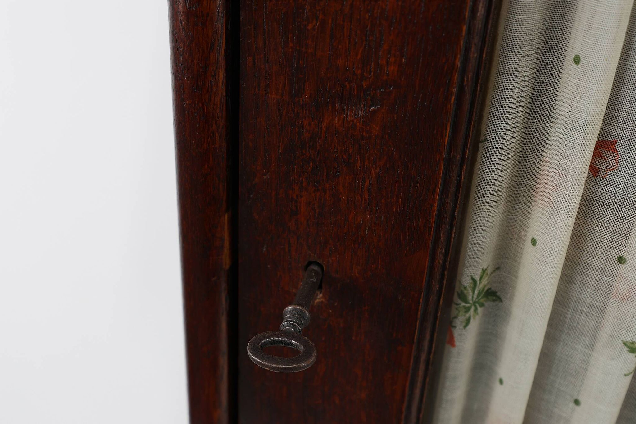 French Art Deco tall cabinet with glass door and hidden compartiment, ca. 1