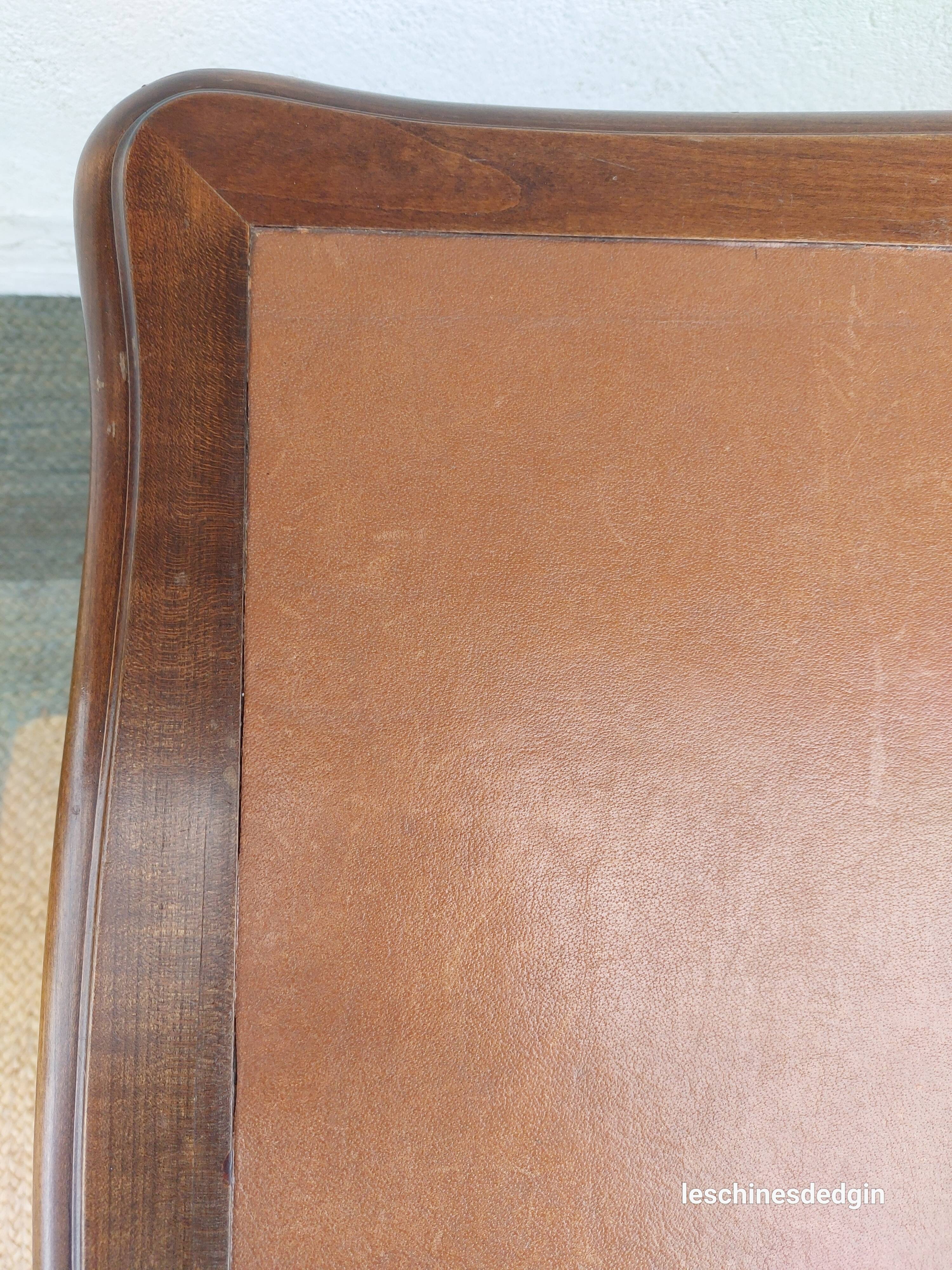 Louis XV style desk in wood, with a brown leather top.