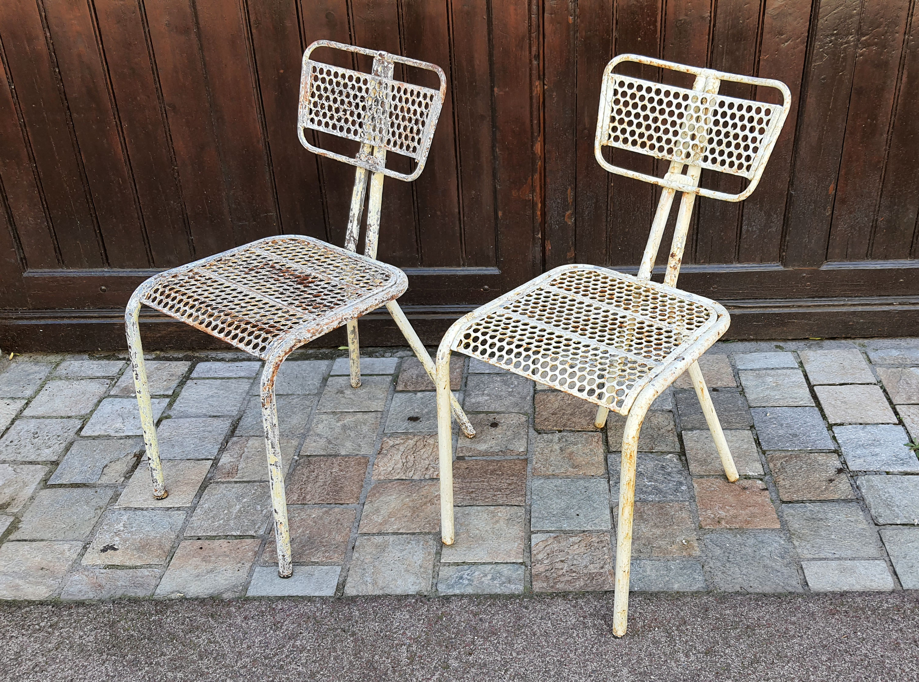 Perforated metal chairs René Malaval 1950