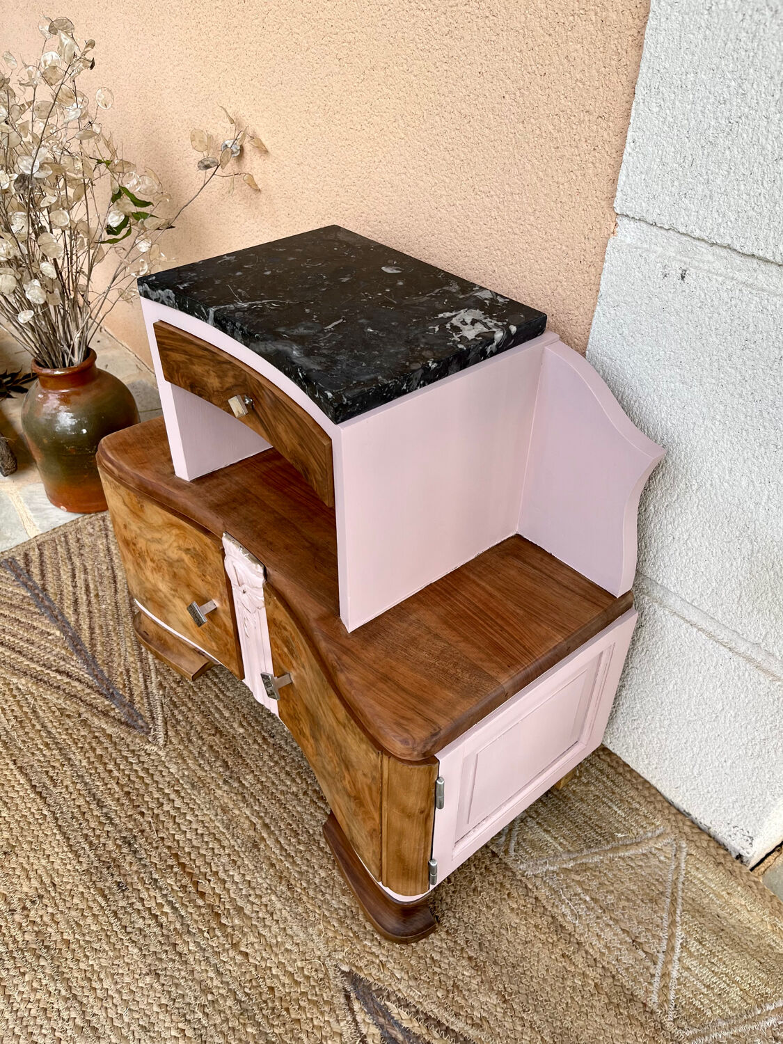 Art Deco bedside table in powder pink painted wood.