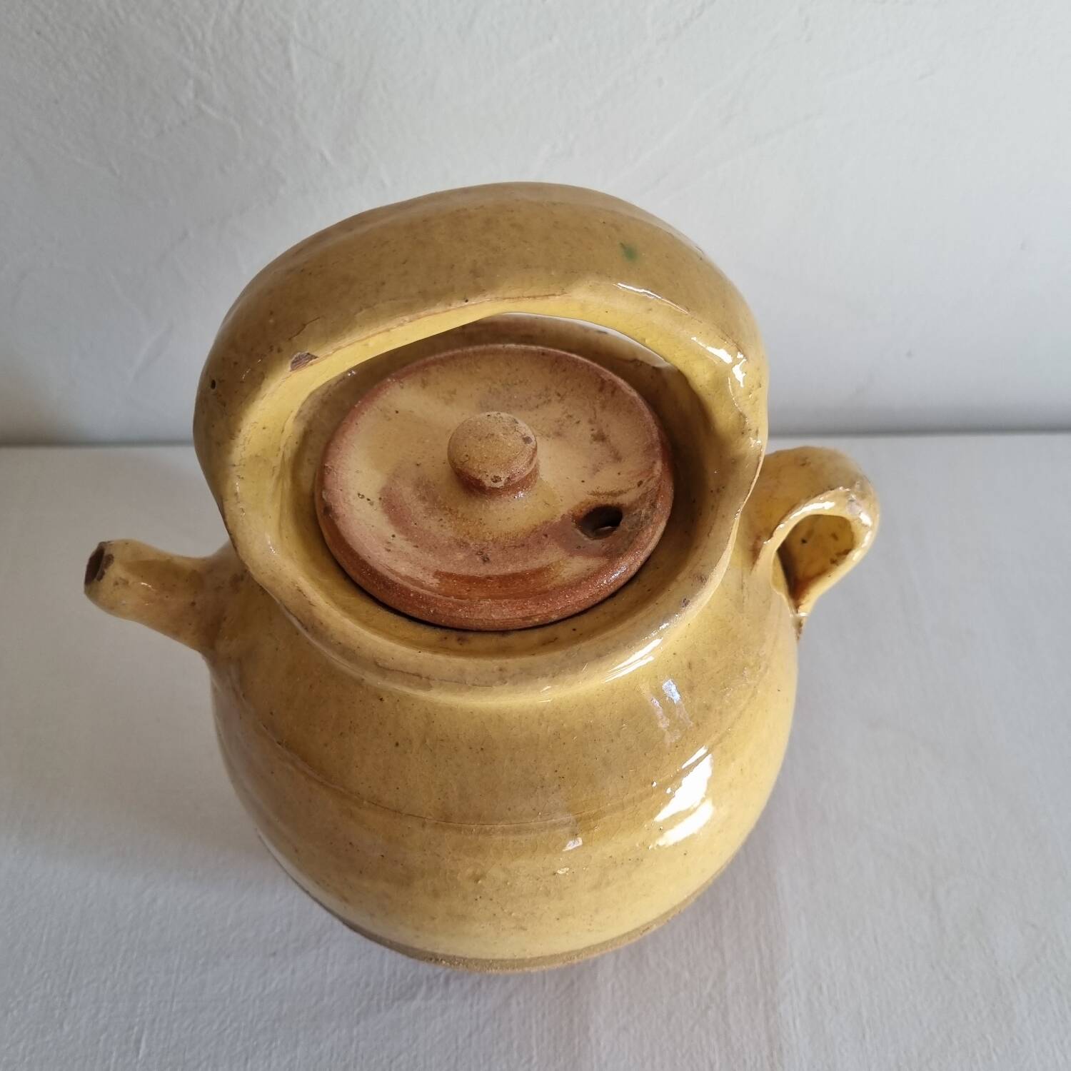 Glazed terracotta jug with lid