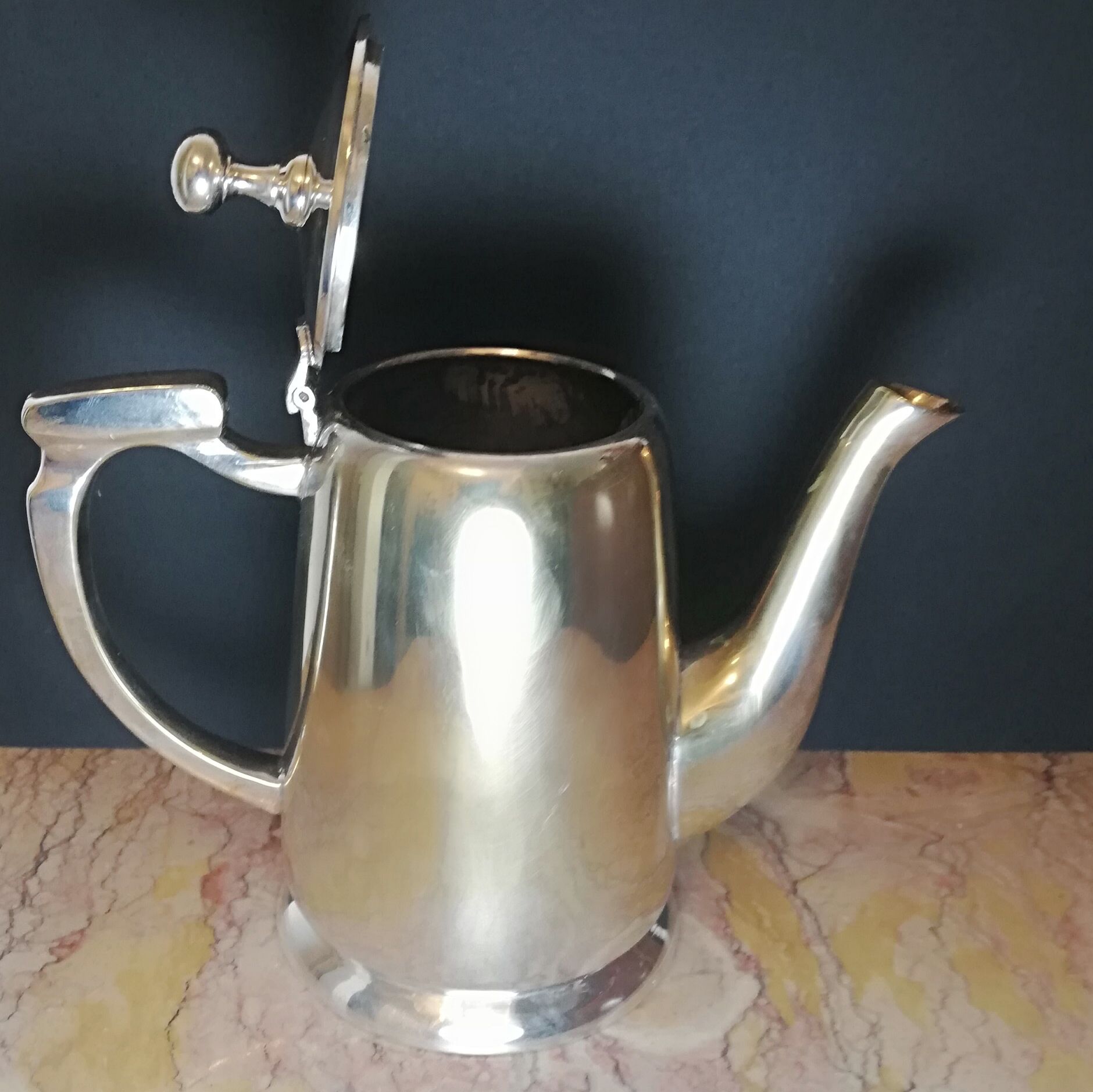 Art deco teapot in silver metal and vermeil reflections