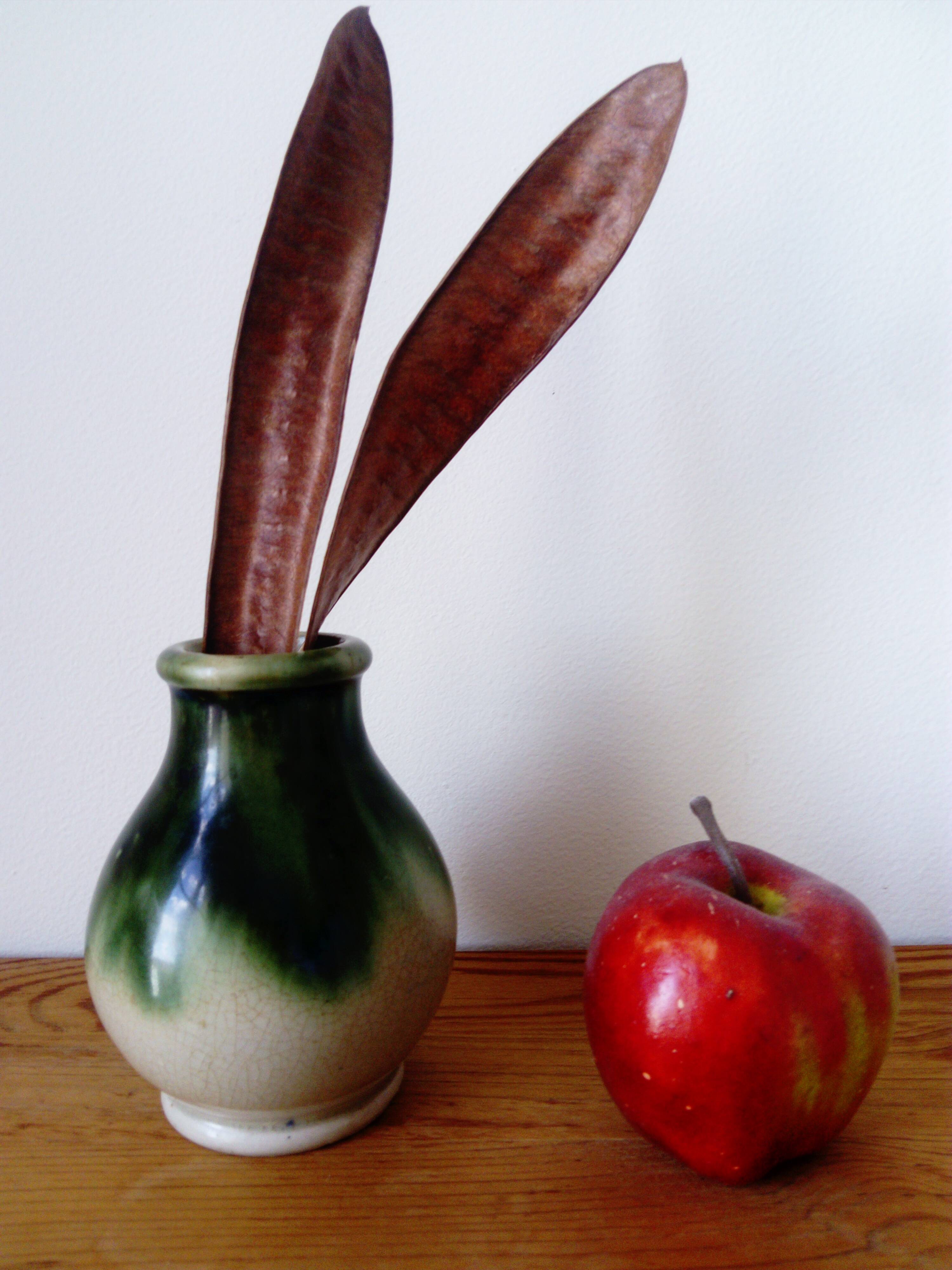 small green and cream glazed ceramic vase
