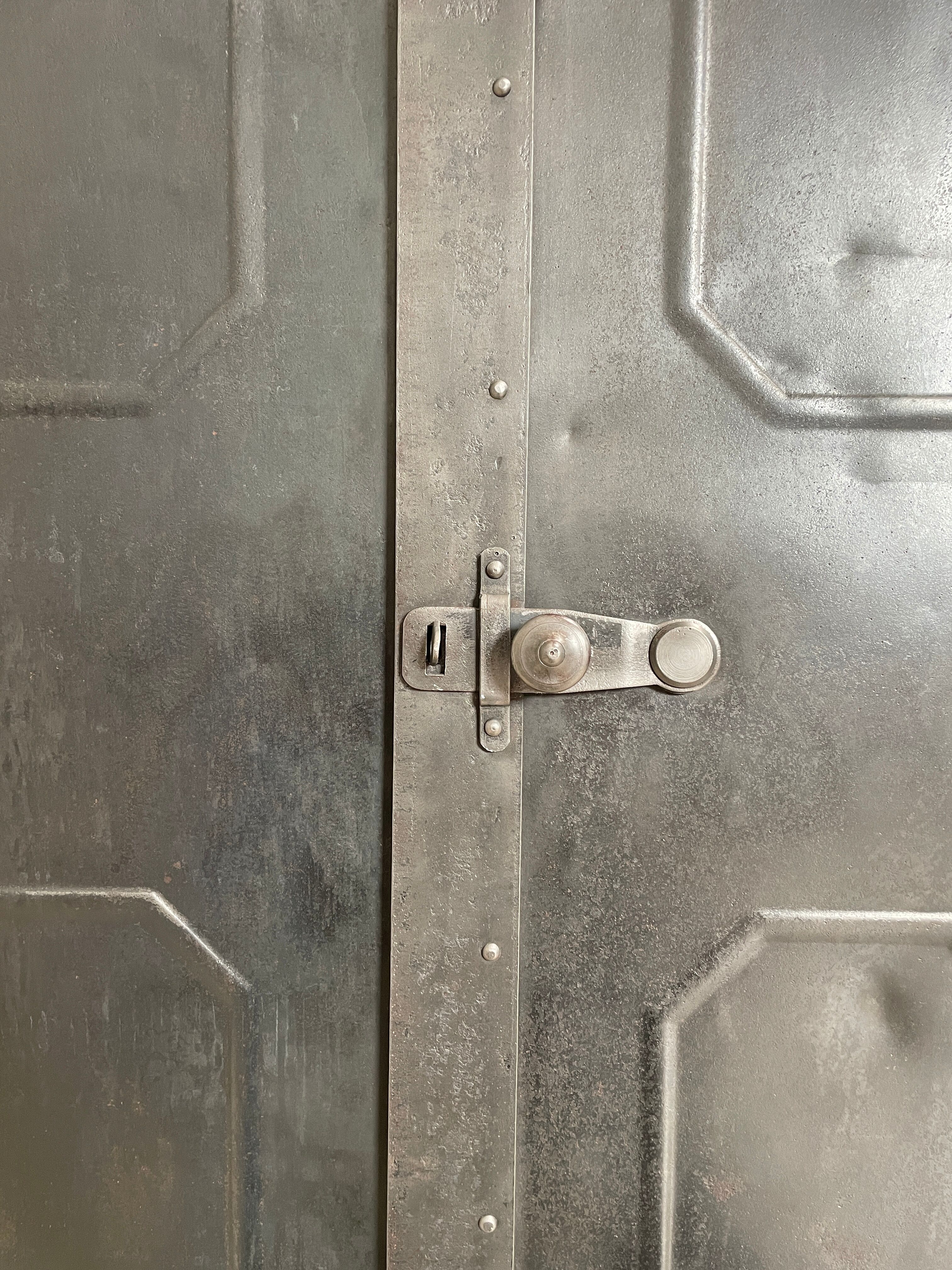 Industrial locker room in raw metal, circa 1930.