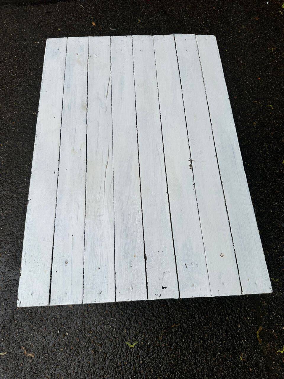 Vintage white wooden kitchen table with drawer from the 19th century.