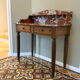 Art Deco console in walnut and marble.