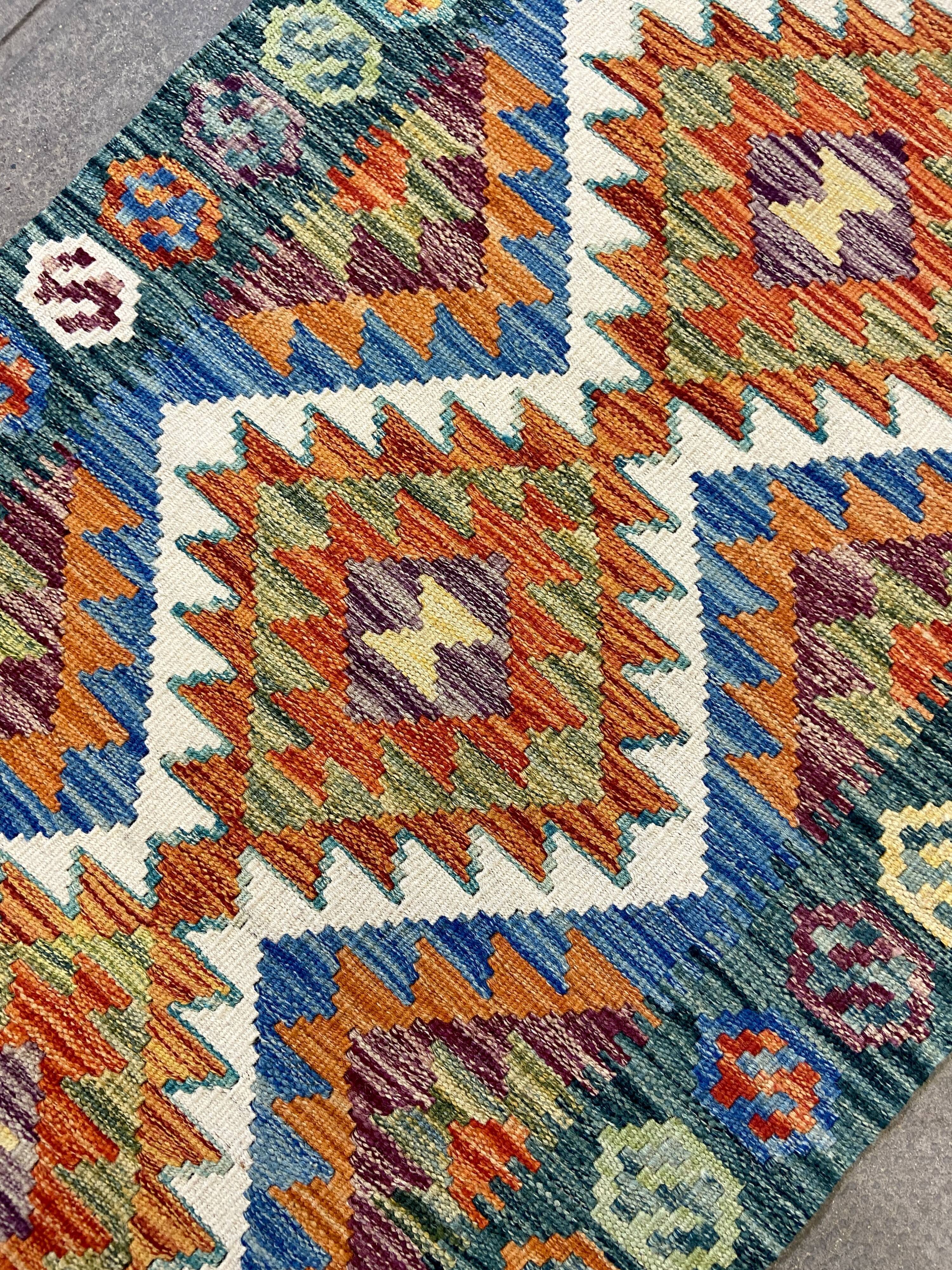 Green and orange hallway carpet