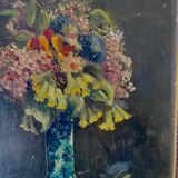 Still life with vase and bouquets of flowers