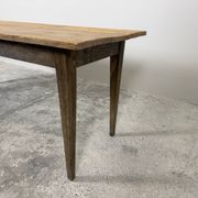 Old farmhouse table with tapered legs, late 19th to early 20th century.