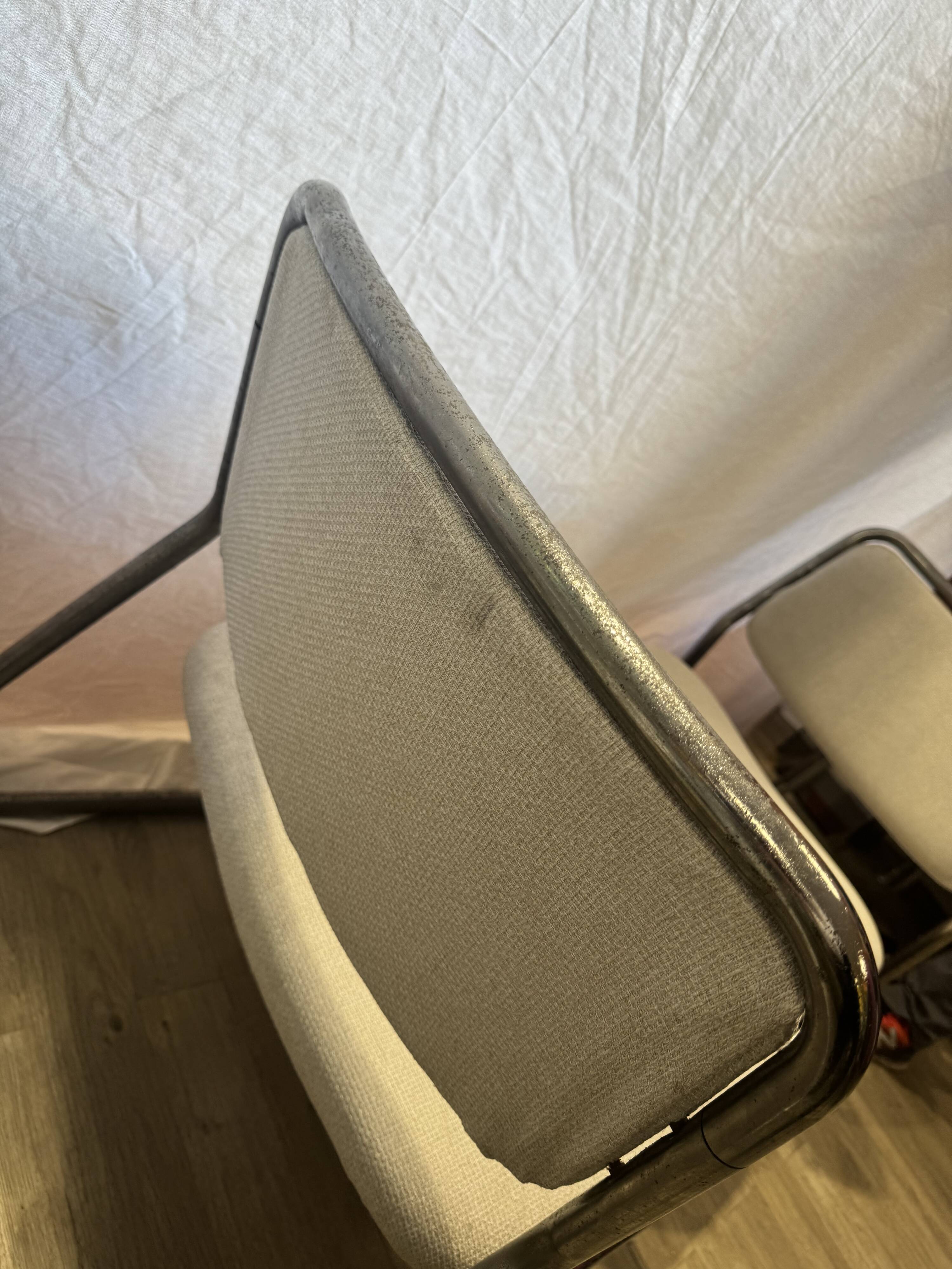 Pair of 70s tubular armchairs