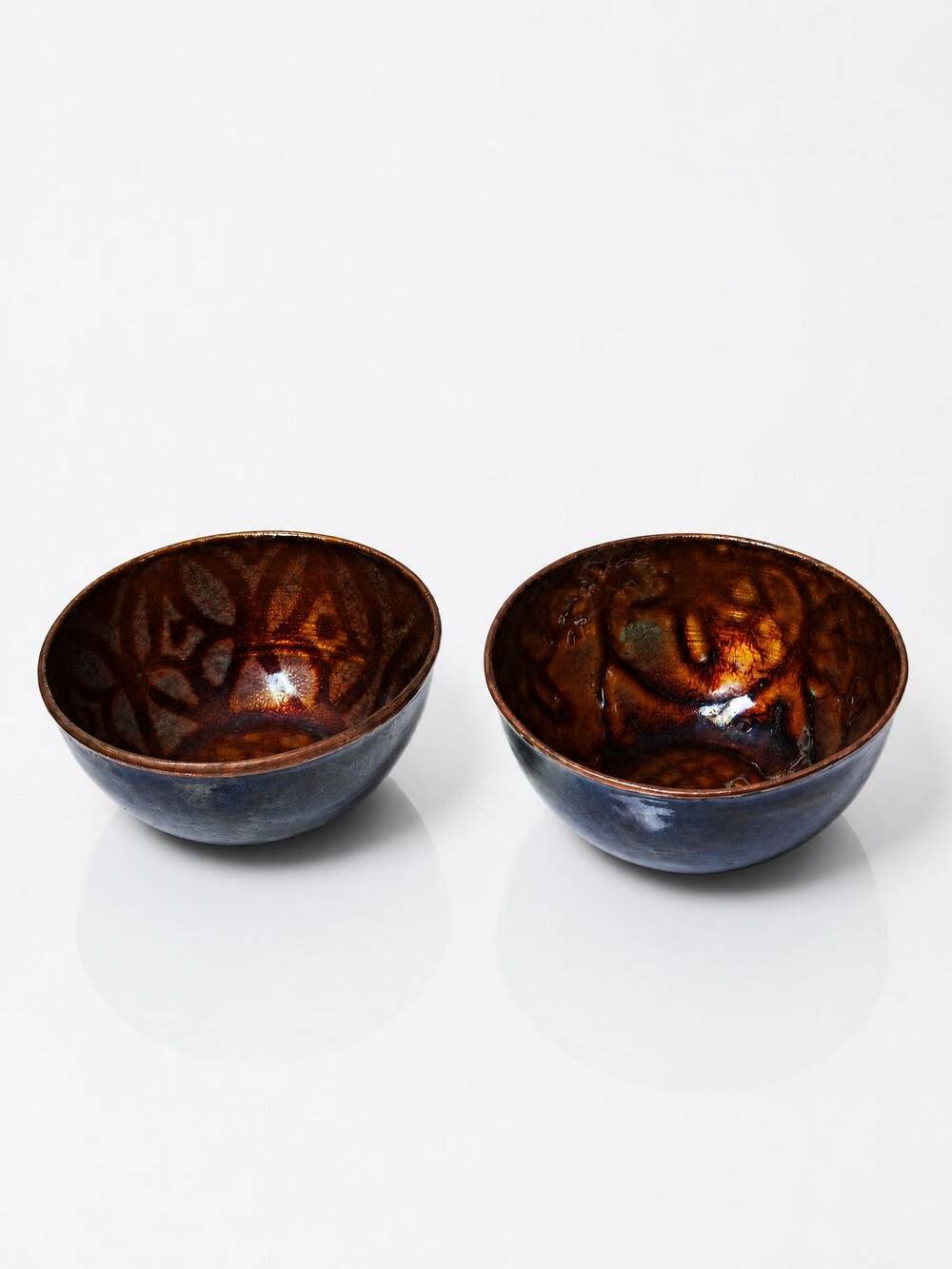 Pair of vintage hand-crafted blue and copper enamelled bowls.