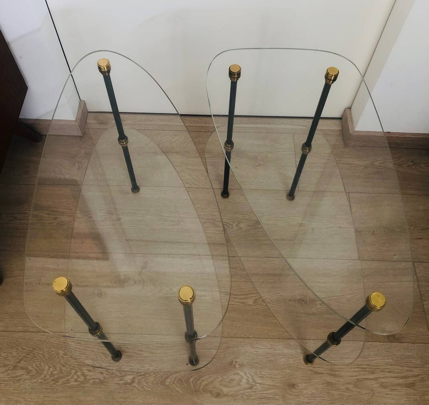 2 small side tables in glass and Bakelite with gold nuts from the 1960s.