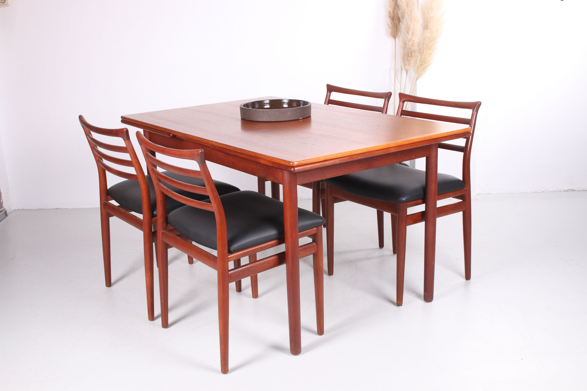 Danish teak draw-leaf dining table