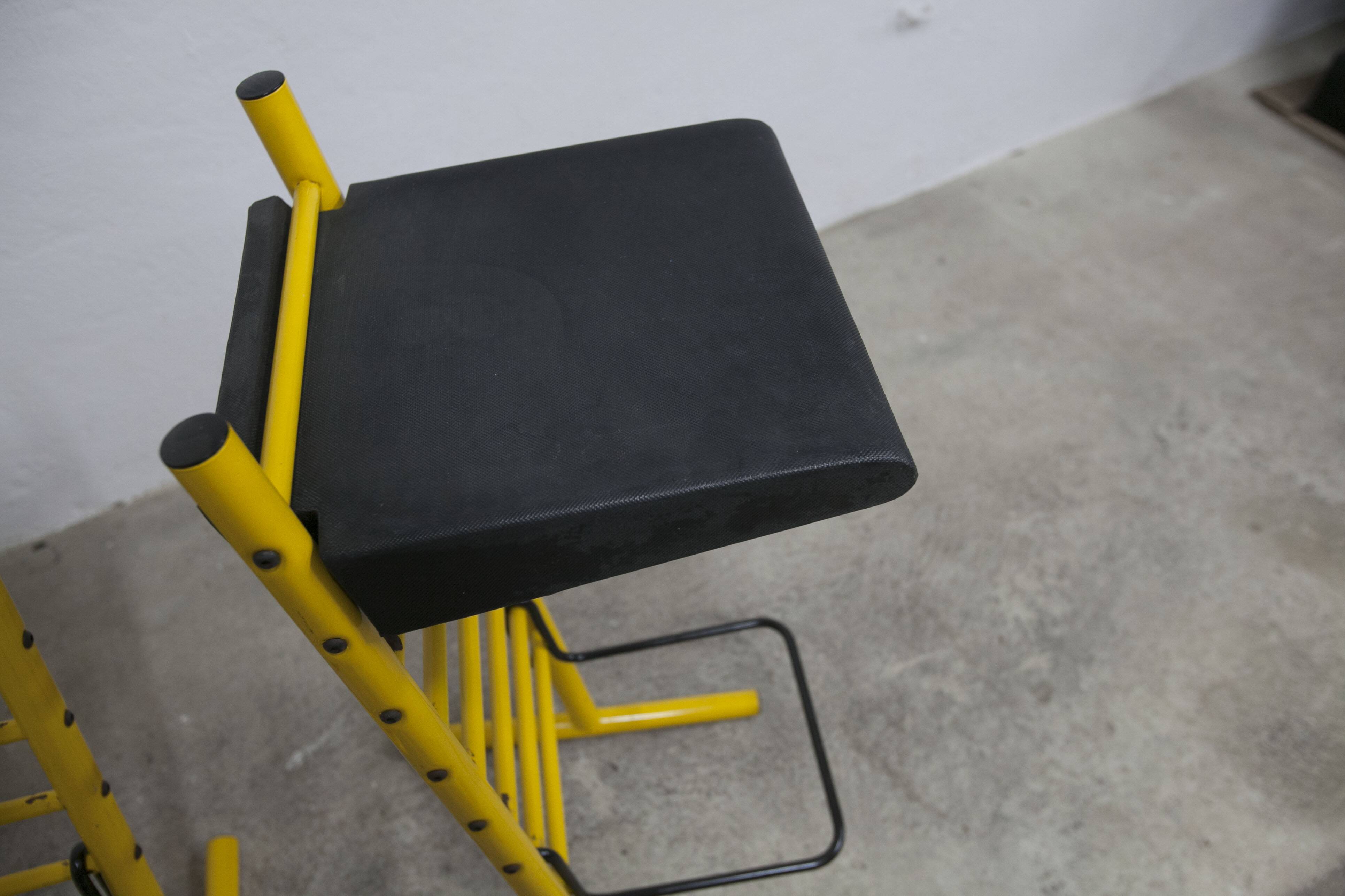 Pair of adjustable Italian bar stools in lacquered yellow and black